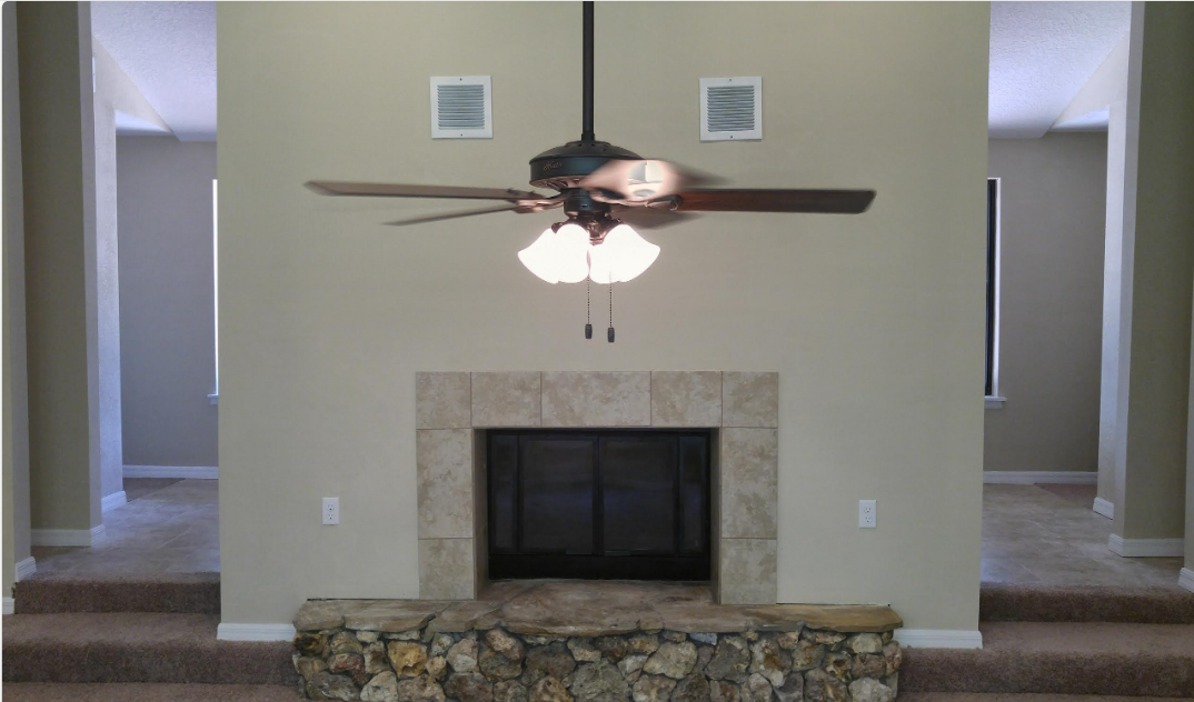 Pine Needles living room fireplace before